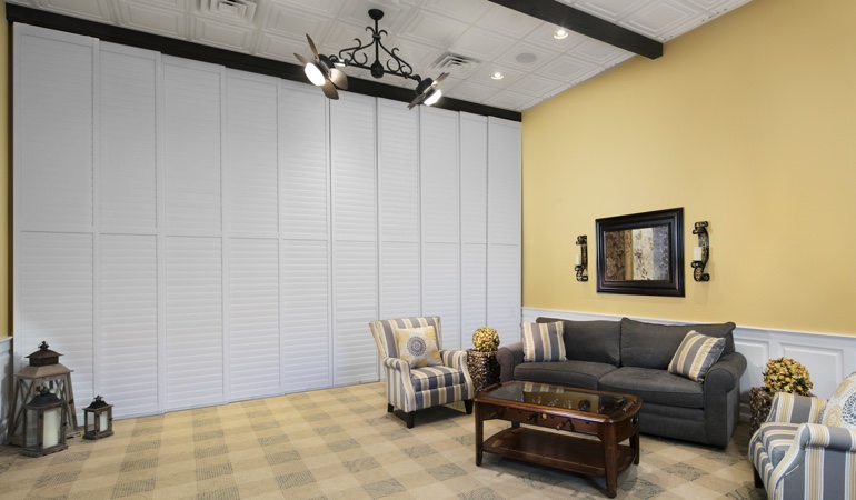 Plantation shutters as a room divider for a showroom